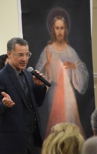 Daniel diSilva explains to an audience at St. Jude Parish in Peoria how a replica of the original image of Jesus as the Divine Mercy, given to him by the Archdiocese of Vilnius in Lithuania, was created using a computer scanning process. (The Catholic Post/Tom Dermody)