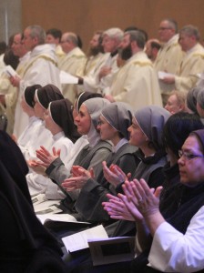 After they renewed their commitment to priestly service, the priests of the diocese were applauded by the Chrism Mass assembly which included permanent deacons, more than 370 Catholic school students, and several communities of women religious. (The Catholic Post/Jennifer Willems)