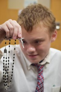 Anthony Stone holds the rosary he received from Pope Francis at the Aug. 31 general audience in Rome. (The Catholic Post/Tom Dermody)
