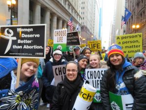 Sister M. Bernadette, FSGM, is surrounded by the students she accompanied from Alleman High School in Rock Island to March for Life Chicago on Jan. 15. Before going to Federal Plaza for the march, they attended a rally and Mass at St. Ignatius Prep in Chicago. (Provided photo)