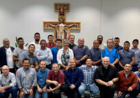 Participants in the Latino Men’s Retreat pose for a group photo Aug. 27 at Sacré-Coeur Retreat Center in Magnolia. Seen standing in the center is Cecilia Soñé, director of Respect Life Ministry and interim director of evangelization and formation for the Diocese of Peoria. (Provided photo)