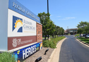 The entrance to the Peoria Cancer Center on Wood Sage Road in Peoria shows the close physical relationship between OSF HealthCare and Illinois CancerCare. The two independent entities announced an enhanced collabortion at a press conference on July 21. (The Catholic Post/Tom Dermody)