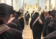 Knights from Council 11361 in Princeville take turns processing to the altar to honor their deceased brothers at St. Mary of the Woods Church on Nov. 19. (Supplied photo)