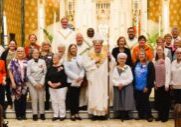 Bishop Louis Tylka stands with volunteers being honored for their volunteer service after Mass at St. Mary’s Cathedral on April 12. The Catholic Post Online/Paul Thomas Moore

