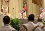 Bishop Louis Tylka elevates the Body of Christ during the Eucharistic prayer at a Mass for the priests of the diocese before the start of their fall Assembly Days on Oct. 22 in Peoria. (The Catholic Post/Paul Thomas Moore)