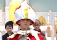 Kyle Kazlauski, then a second grader at St. Thomas the Apostle School in Peoria Heights, is dressed as Pope St. John Paul II, flanked by an altar line of saints in this photo from the Nov. 13, 2023 issue of The Catholic Post. (Provided photo) 