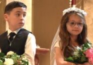 Faces of anticipation and contemplation as   second-graders Cisco Head and Gianna Foster await their roles in the crowning of Mary at the rededication Mass celebrating the completion of renovations to Epiphany Catholic School in Normal on April 30.  The Catholic Post Online/Paul Thomas Moore  