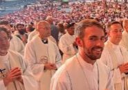 Father Patrick Wille (foreground), parochial vicar of St. Mary Parish in Moline had the honor of participating in the procession of the monstrance at the National Eucharistic Conference. The Catholic Post Online/Bob Wille